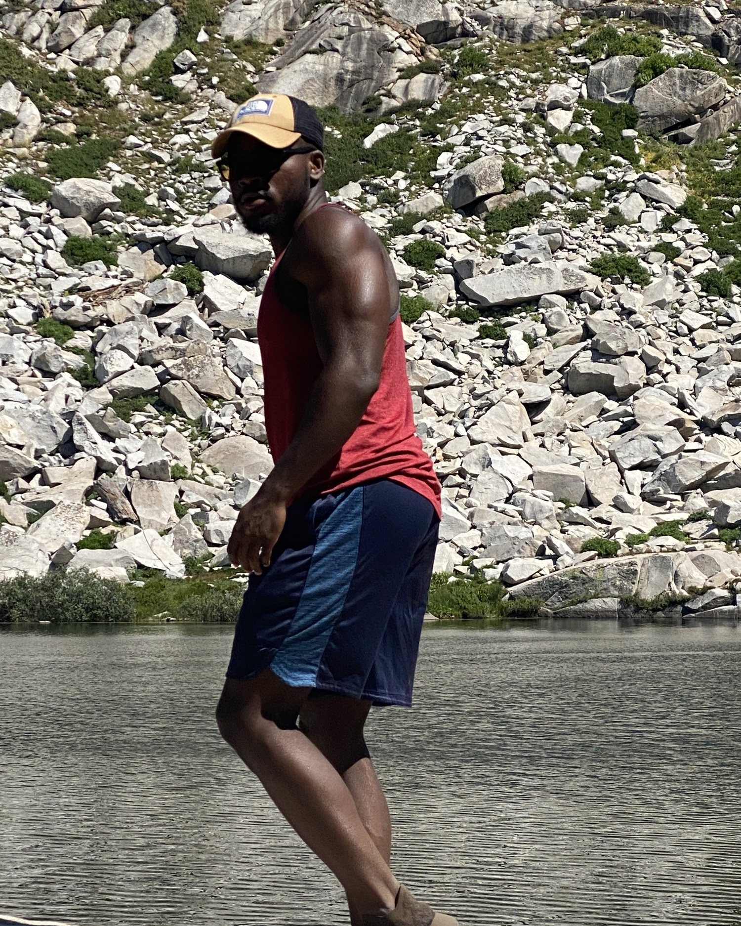Ozzy walking beside a mountain lake