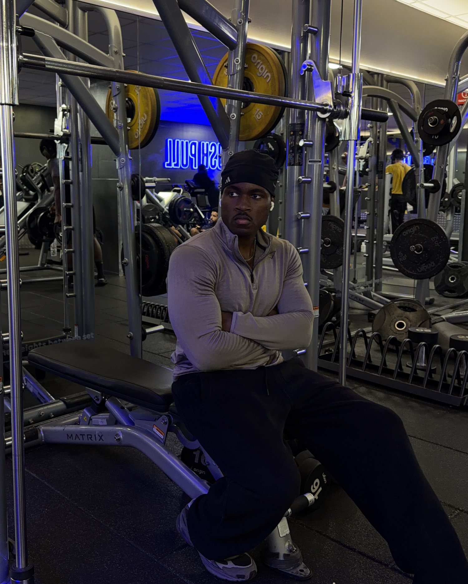 Ozzy in the gym, arms crossed